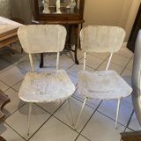Pair of white metal chairs