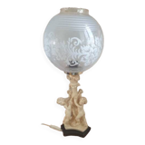 Table lamp, with globe cherub decoration