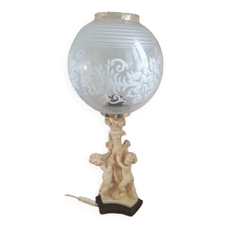 Table lamp, with globe cherub decoration