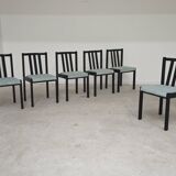 Set of 6 modernist black chairs with light blue-green ribbed fabric.