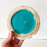 Ceramic trivet and bottle coaster from the 1950s.