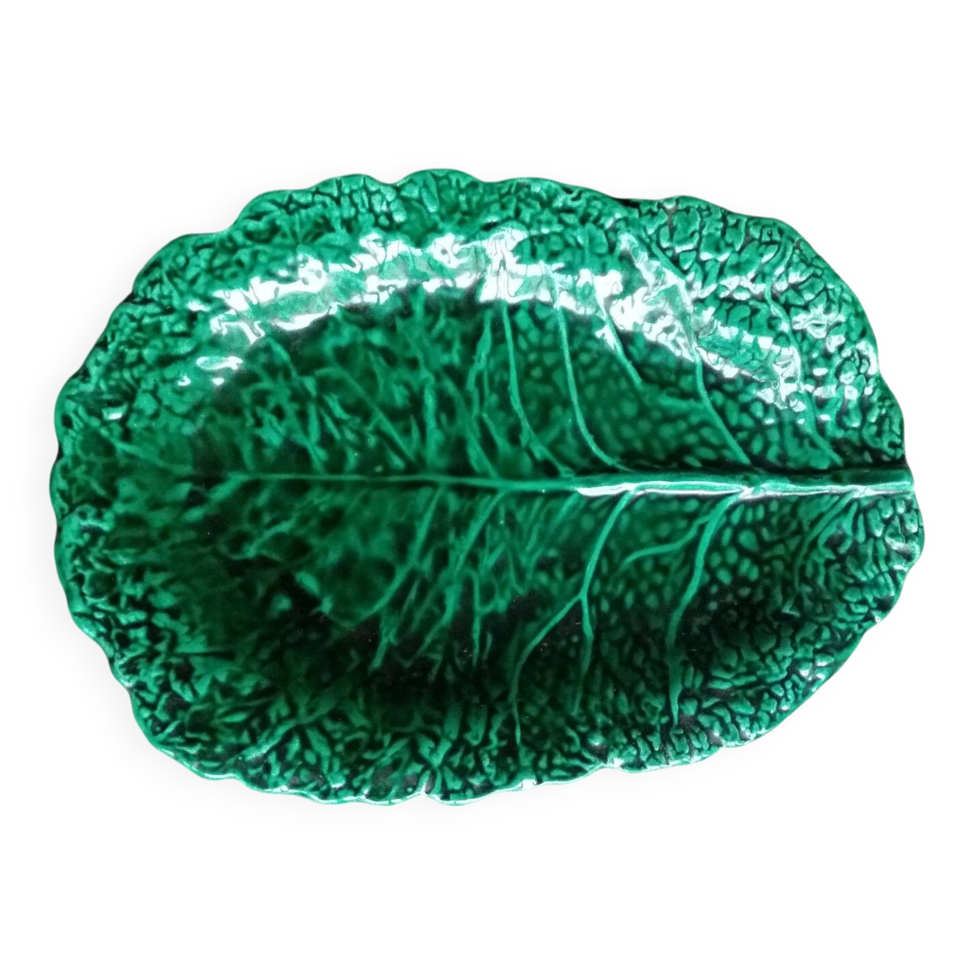 Large dish in green cabbage leaf slip