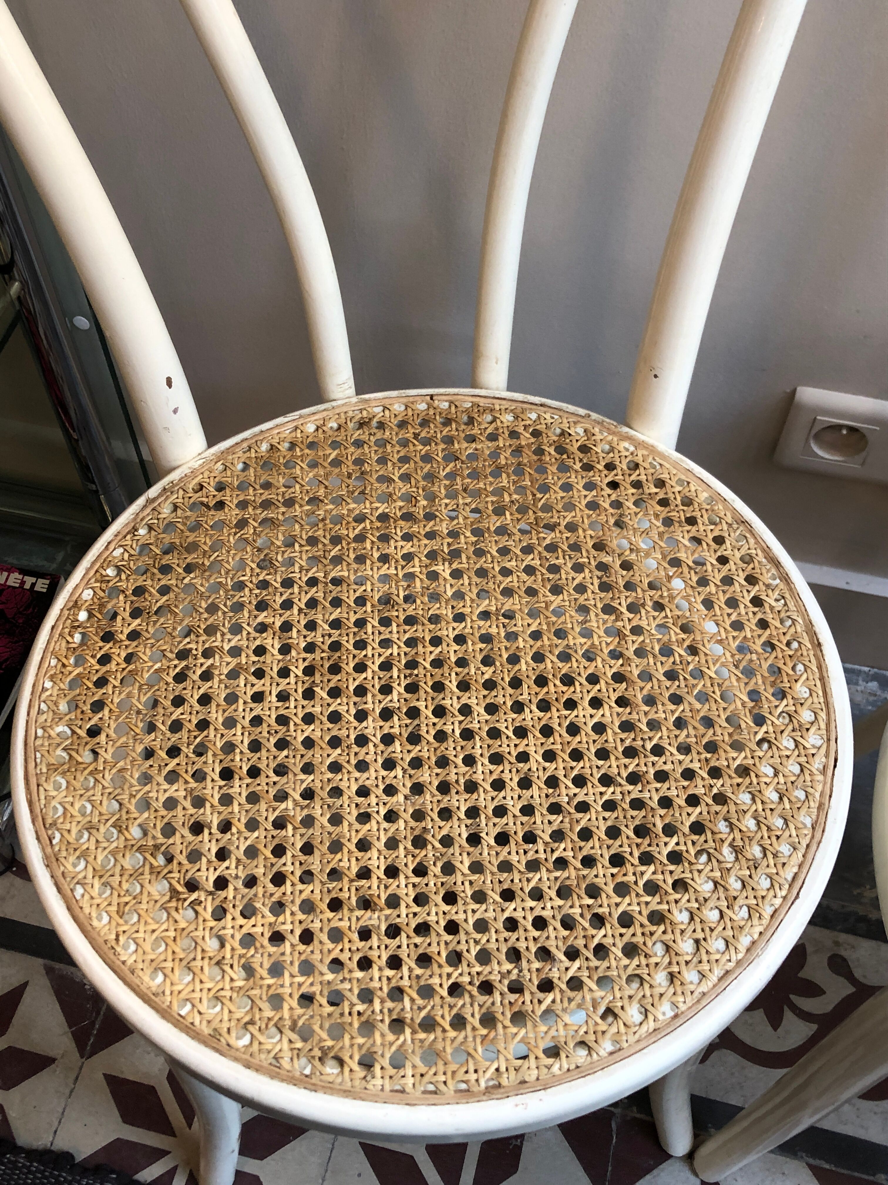 Couple of white bistro chairs