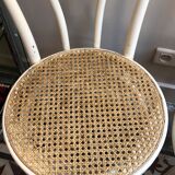 Couple of white bistro chairs