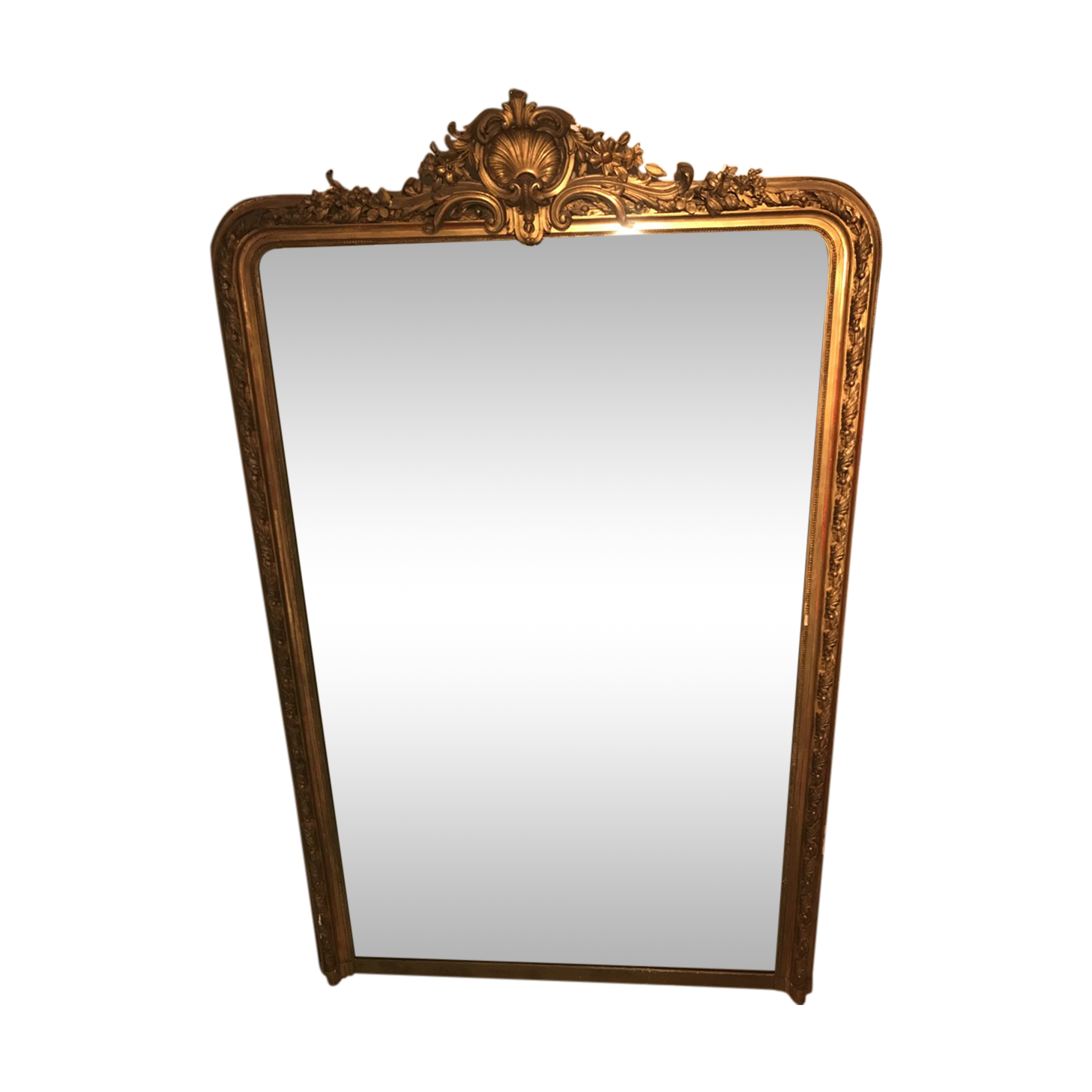 Large antique mirror with flagship shell in wood and gilded stucco