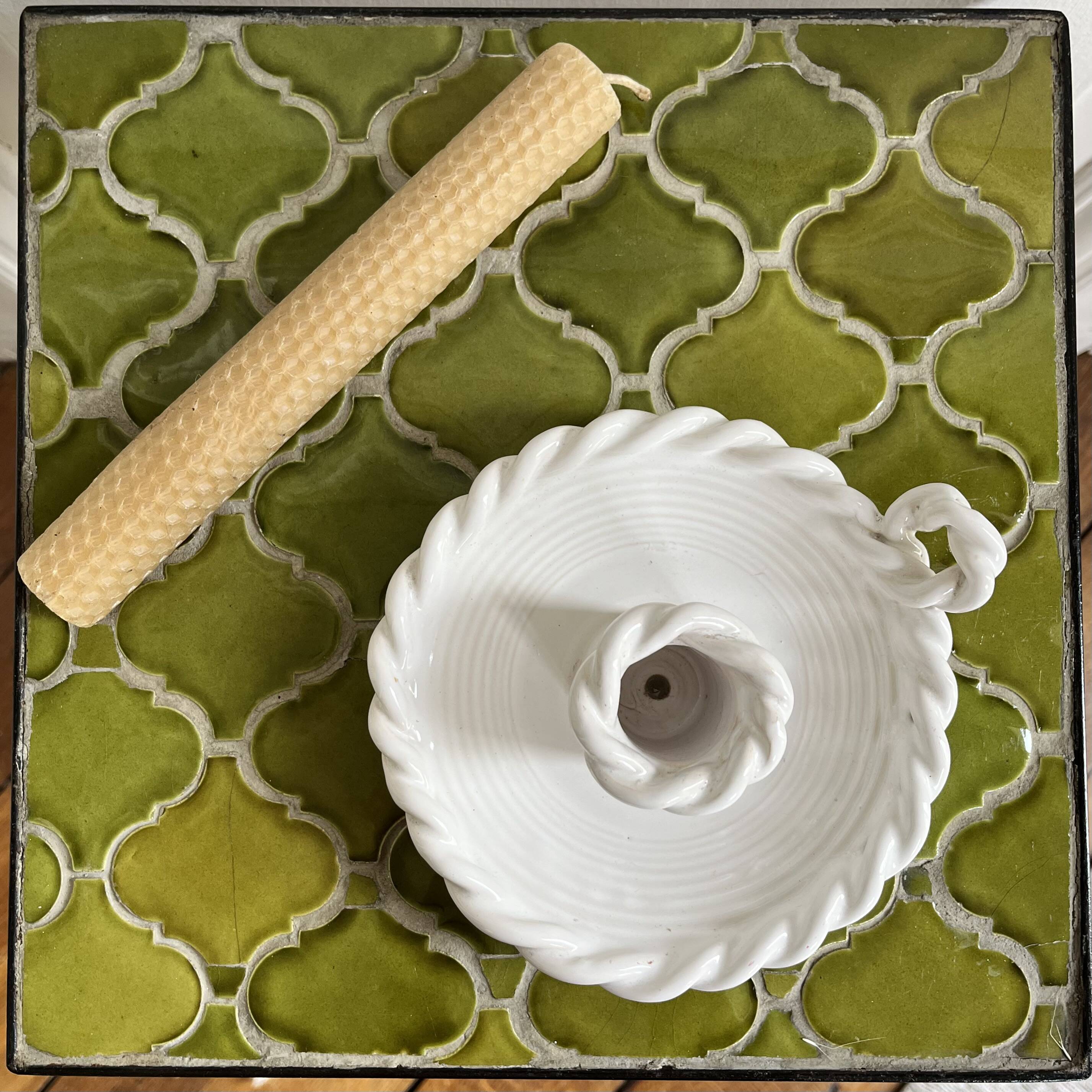 Hand-held candle holder with braided ceramic bowl