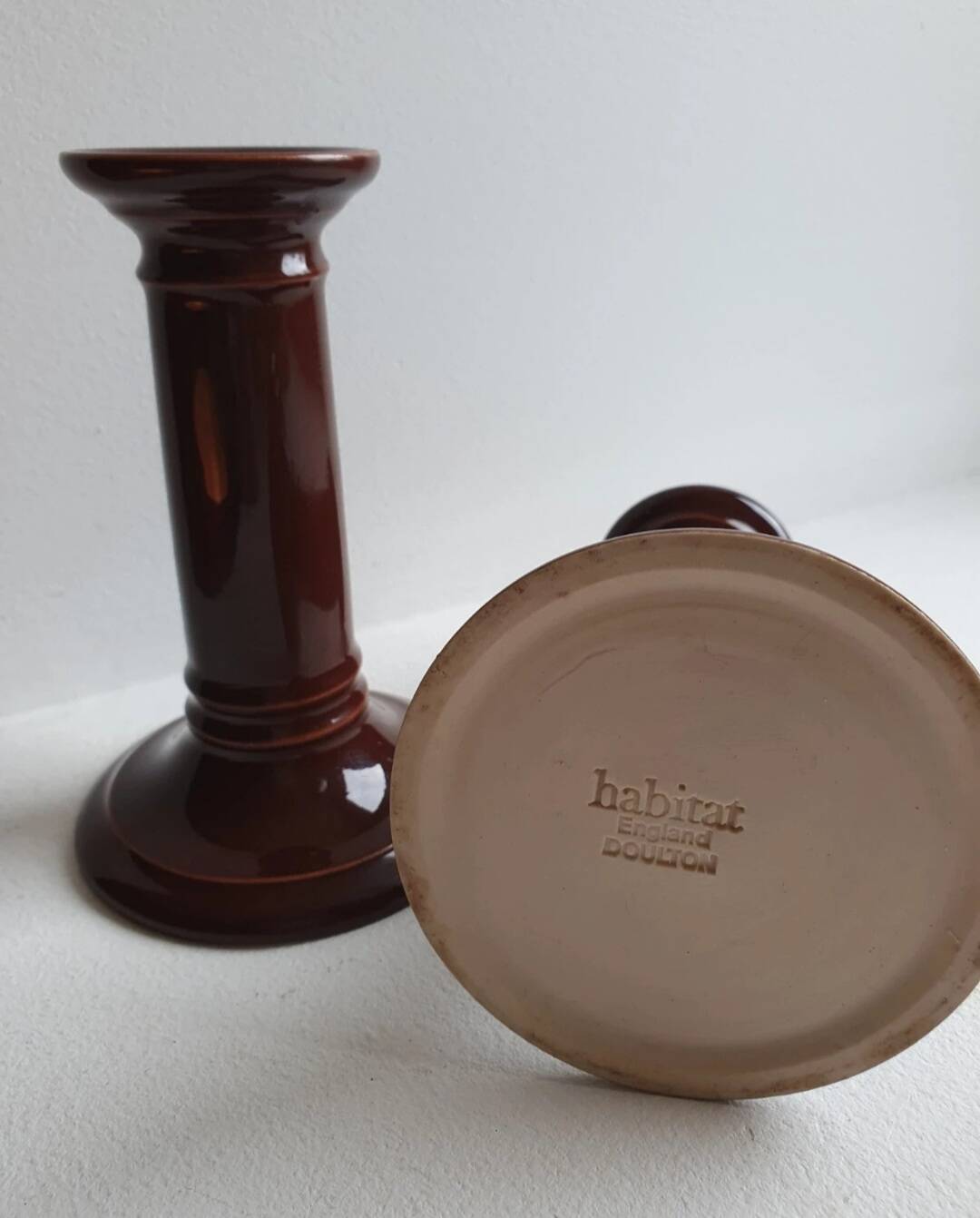 Pair of English brown ceramic candlesticks. Circa 2003, designed by S.