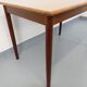 Rectangular dining table in vintage Scandinavian style made of teak and melamine.