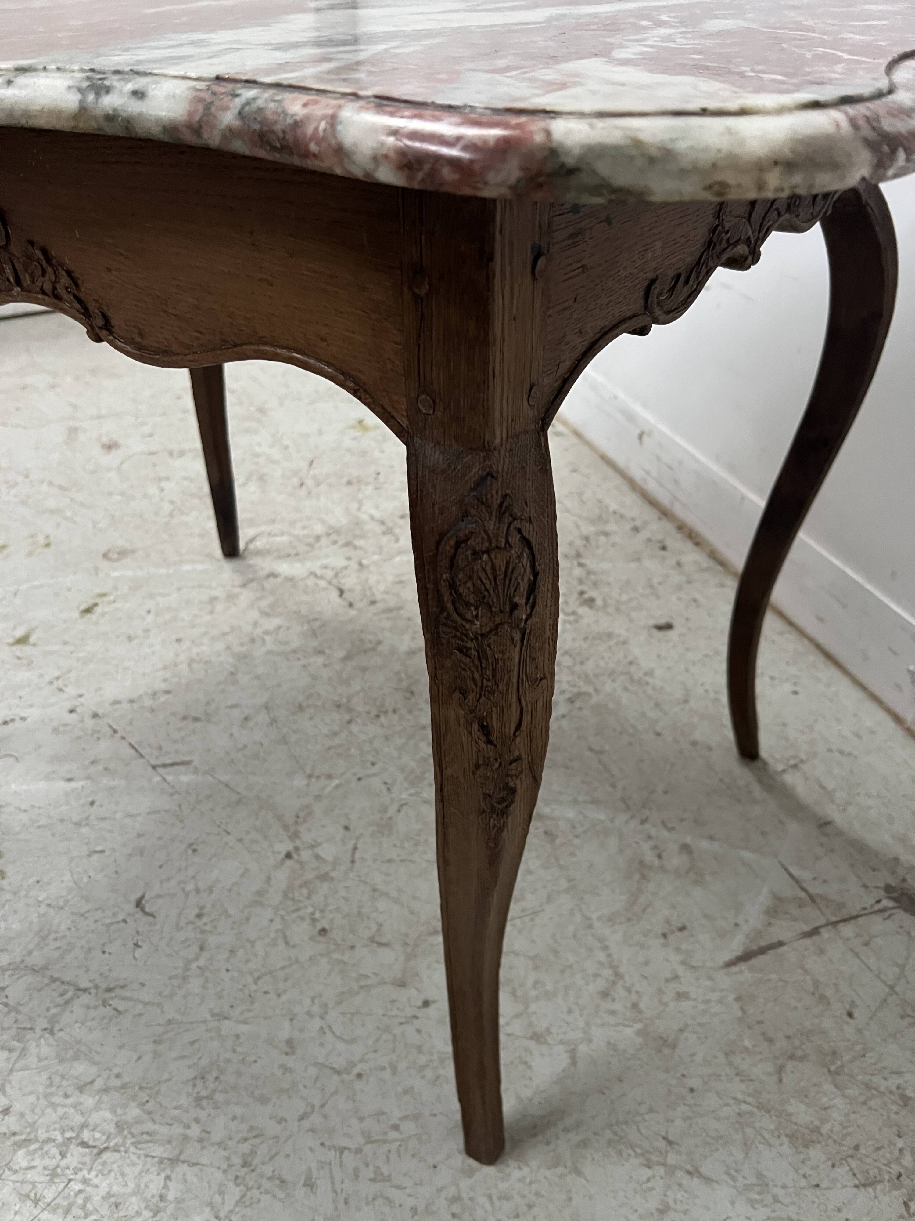Louis XV mid-table in oak and marble, 18th century.
