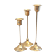 Trio of brass candlesticks