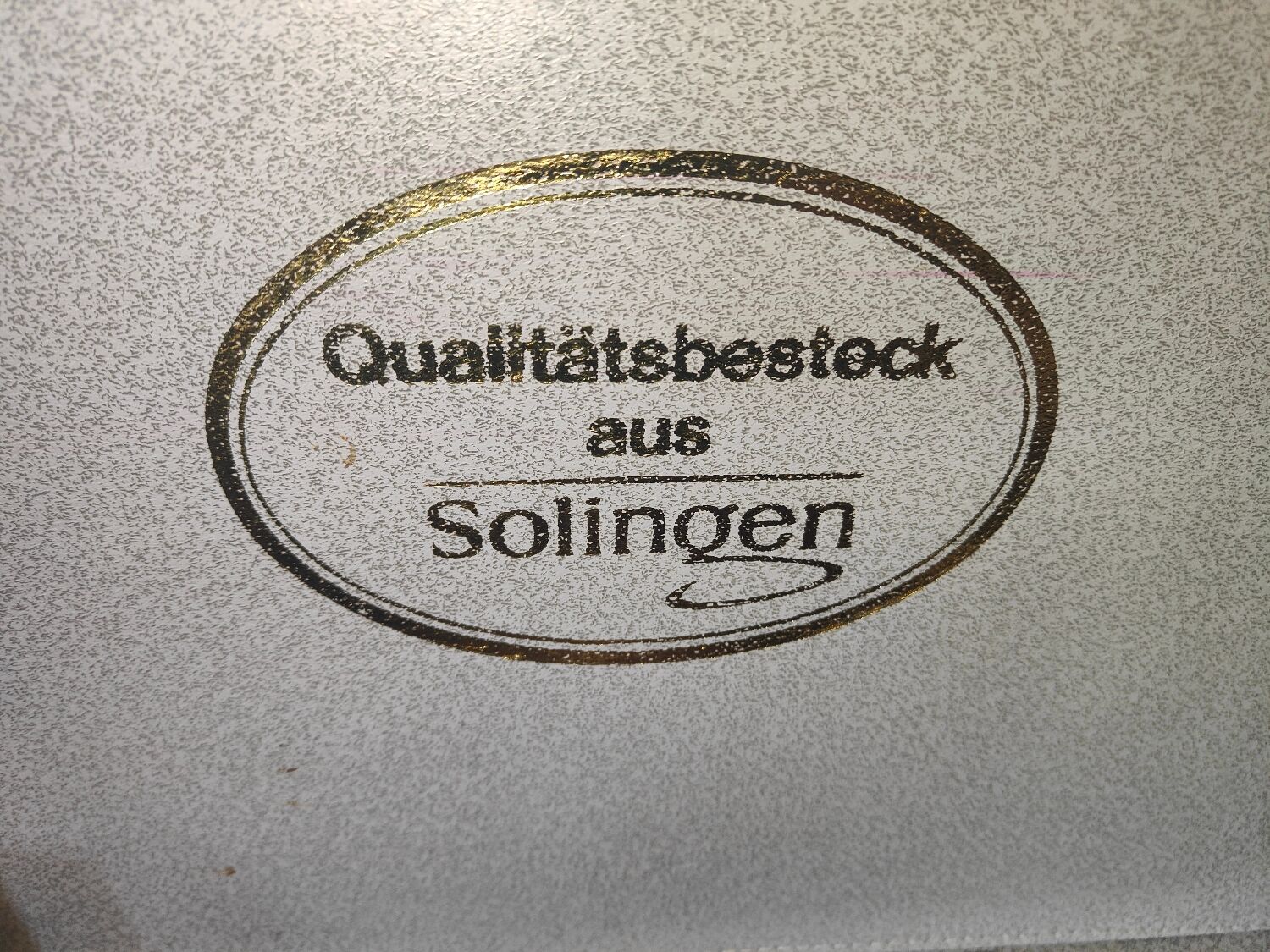 Housewife 70 covers Qualitats besteck Solingen in her suitcaseRostfrei