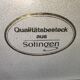 Housewife 70 covers Qualitats besteck Solingen in her suitcaseRostfrei
