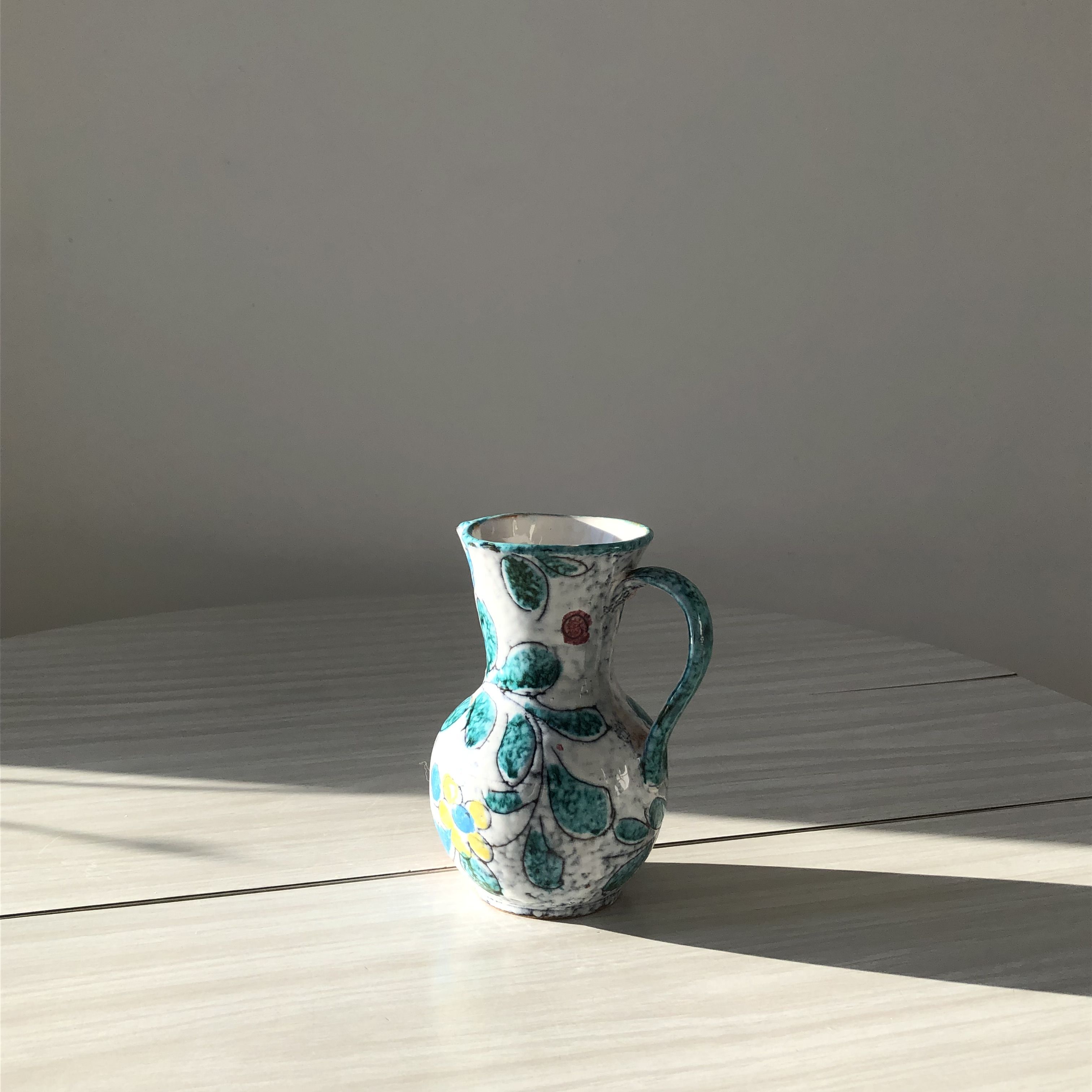 Ceramic vase pitcher with handles. Floral decoration, made in Italy.