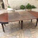 Oval table with extensions in massive mahogany napoleon III era.