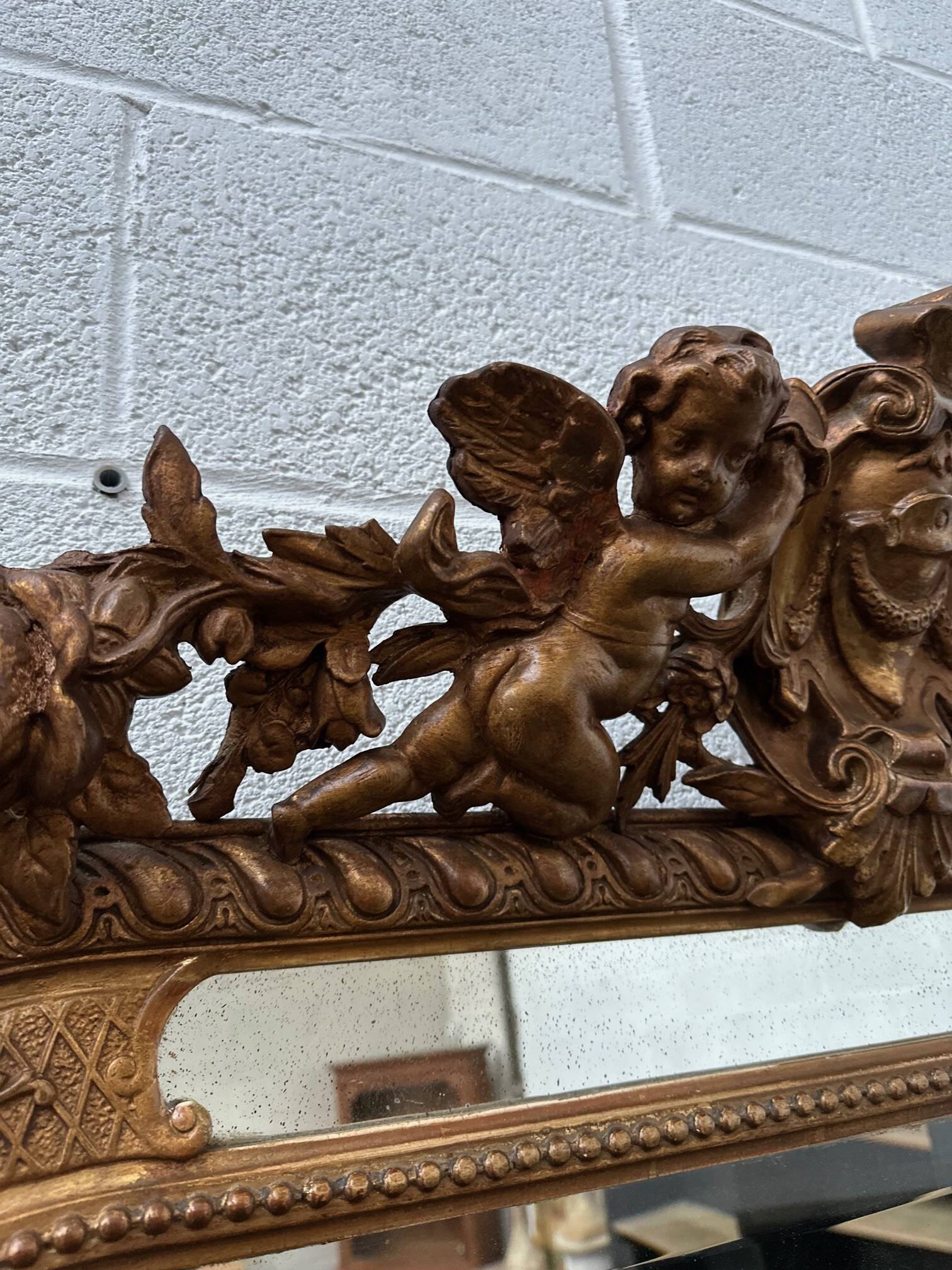 19th century mirror with cherubs