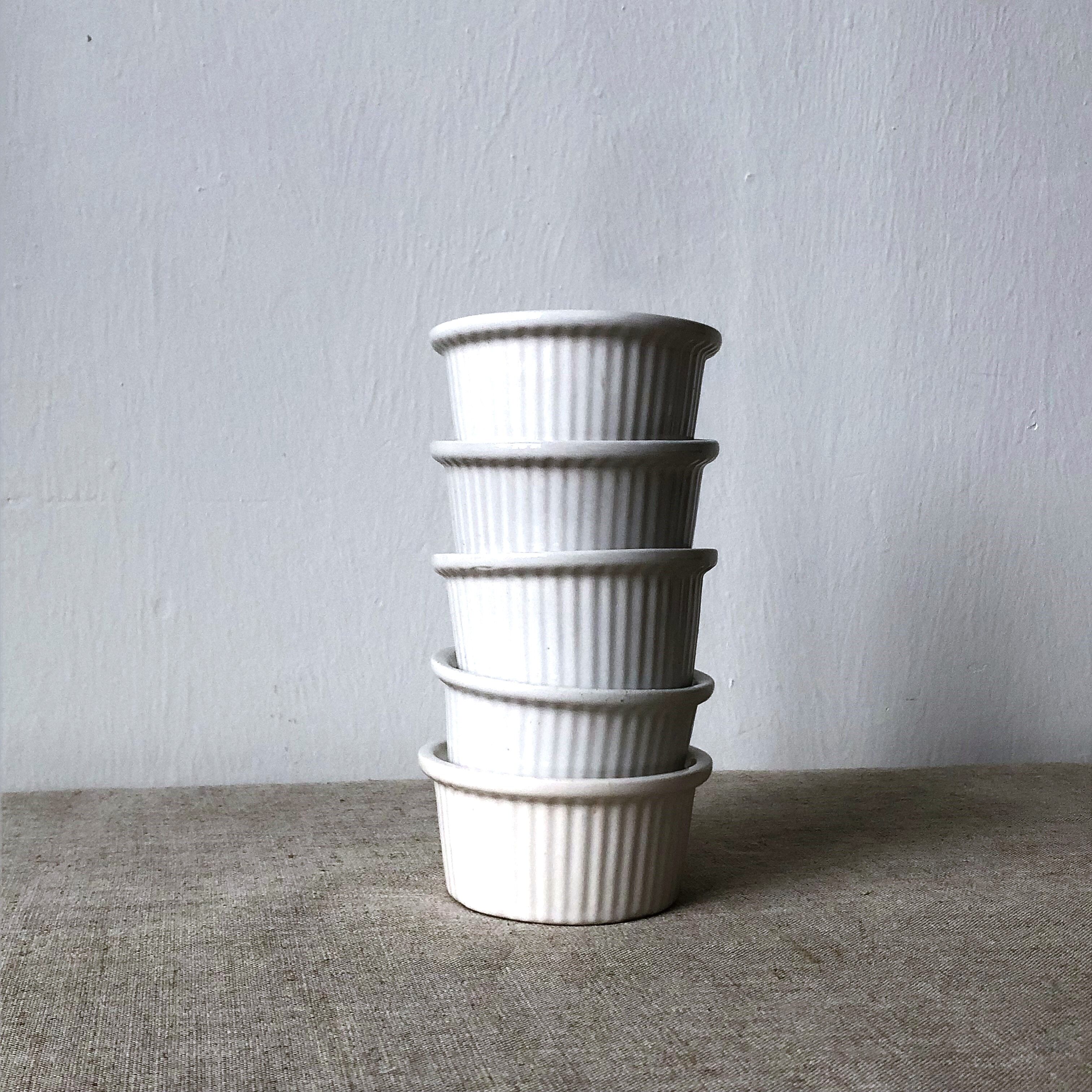 Pleated ramekins for white enamelled crème brûlée.