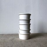 Pleated ramekins for white enamelled crème brûlée.