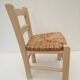 Children's chair of greige color in wood and straw