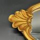 Miroir style baroque – bois doré sculpté – volutes et coquille