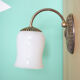 Metal wall lamp and serrated glass globe