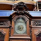 Antique rococo sideboard with integrated clock.