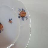 set of 4 dessert plates in white Limoges porcelain with flowers, the edge of one is different