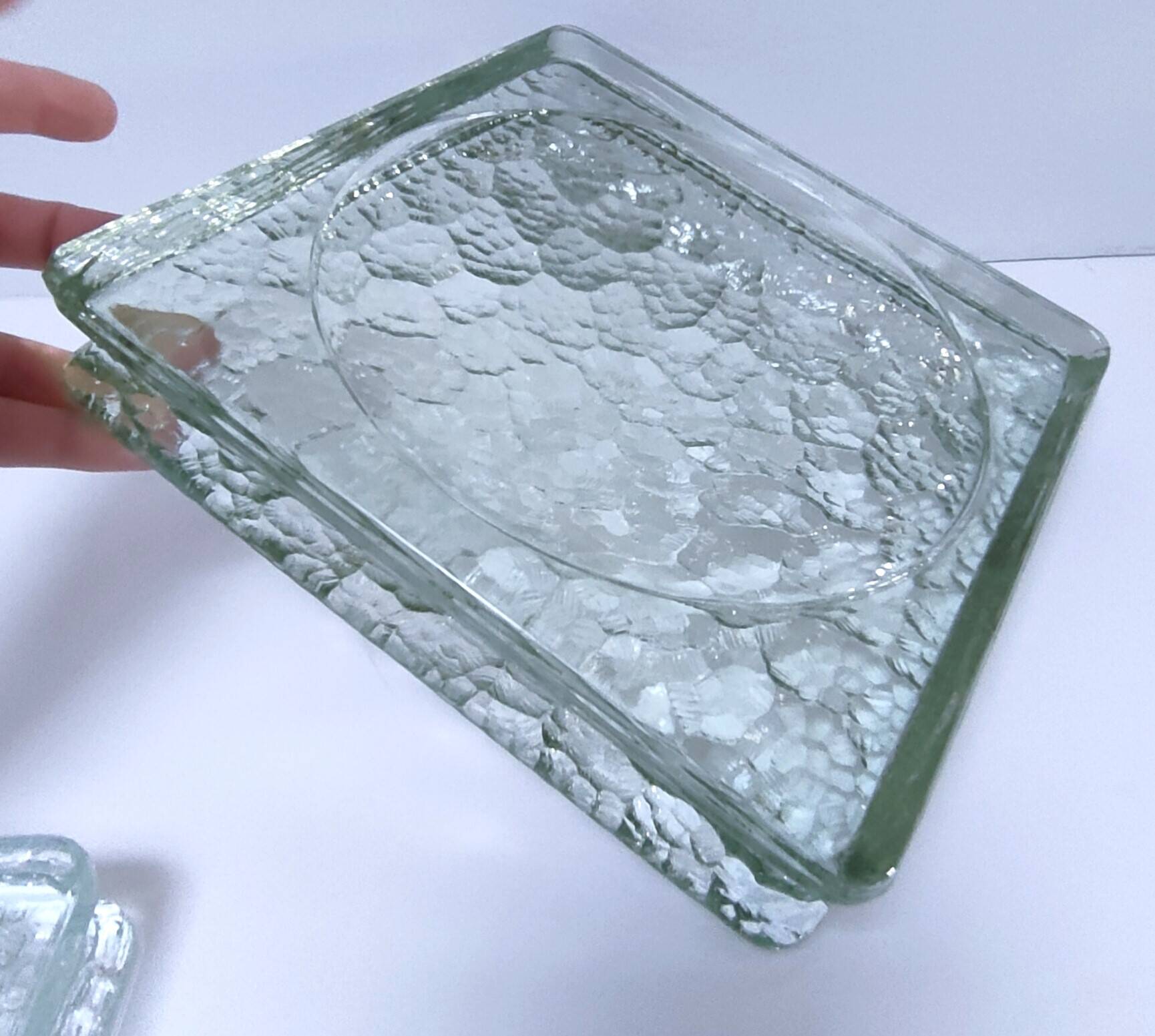 Two designer glass paving pockets