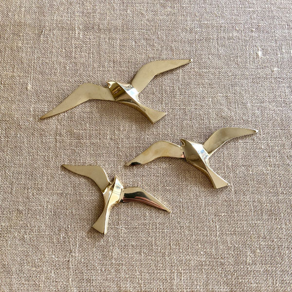 Series of 3 golden brass seagulls to hang