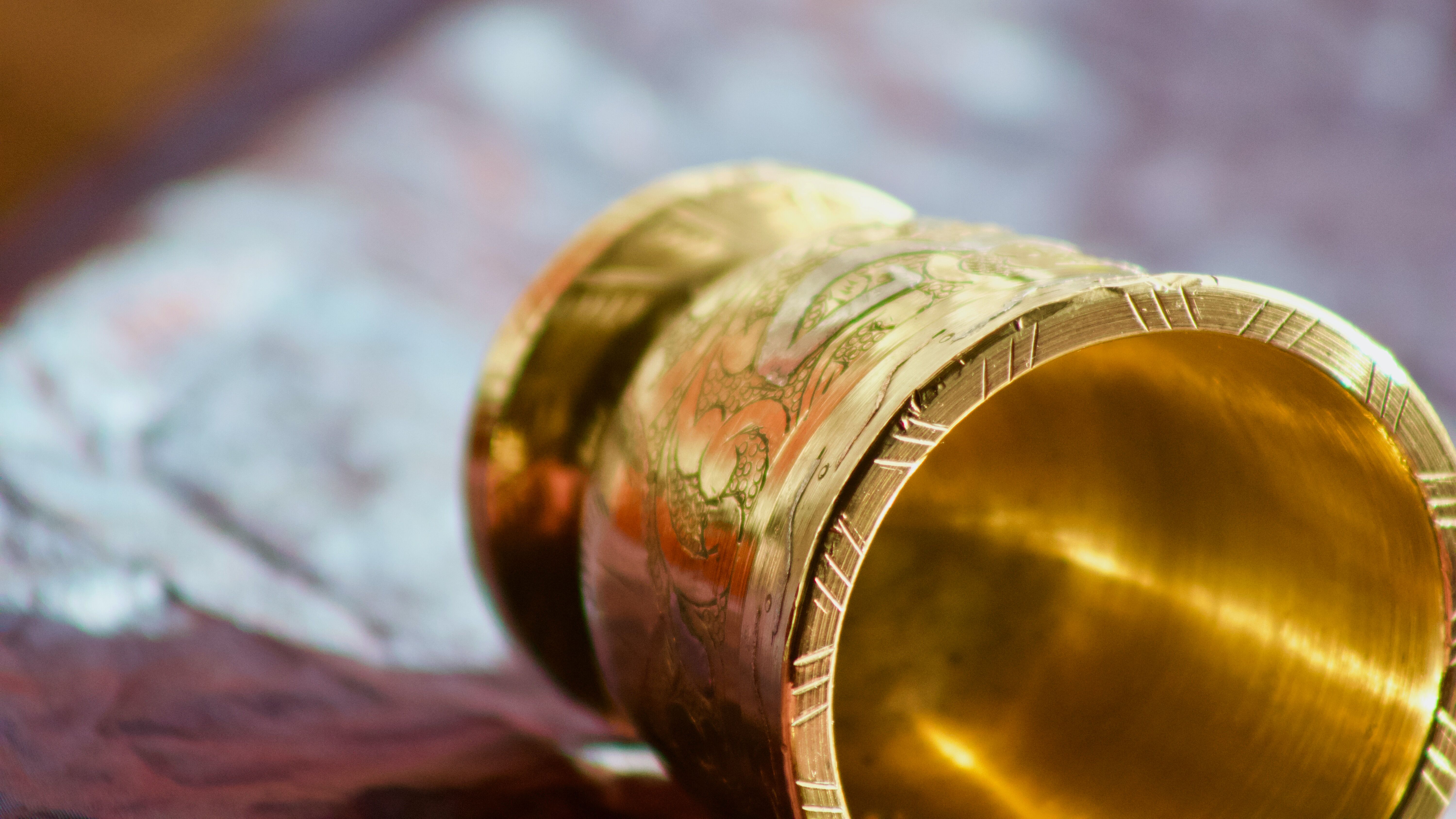 Mortar and its brass pestle with oriental gold and silver motifs