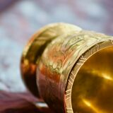 Mortar and its brass pestle with oriental gold and silver motifs