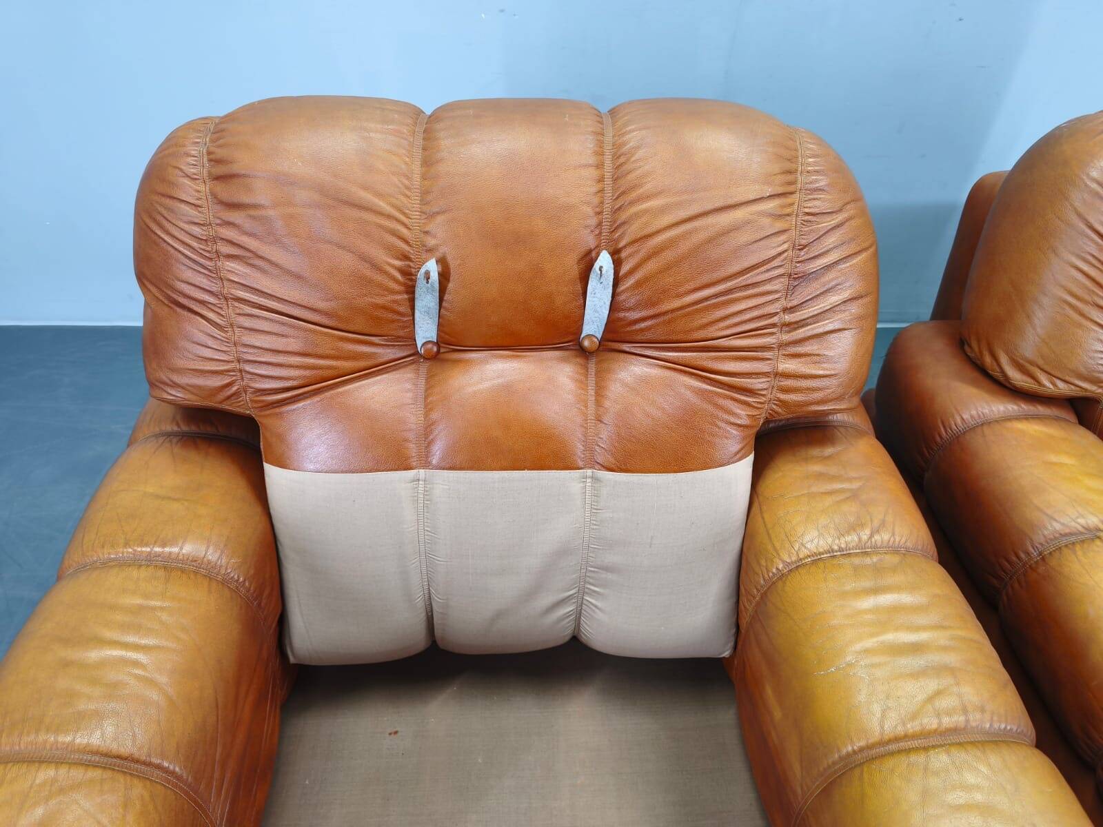 Pair of modern Italian armchairs from the mid-20th century, cognac leather, 1970.