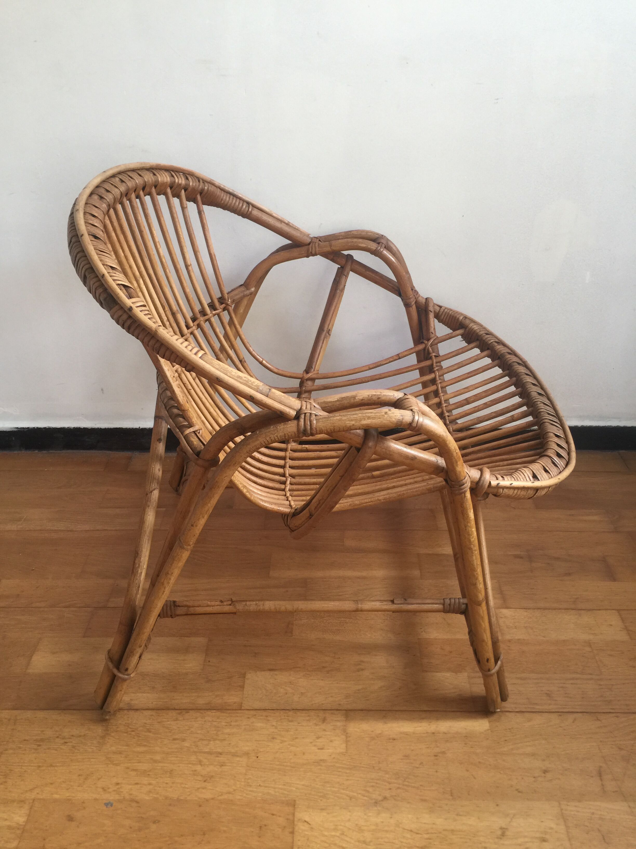Shell rattan armchair
