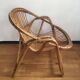 Shell rattan armchair