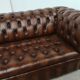Light brown leather chesterfield sofa upholstered