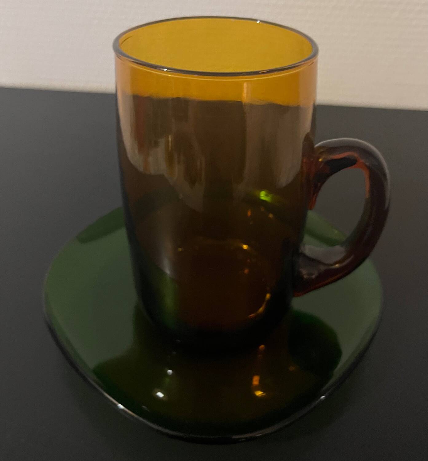 3 amber cups and green saucer