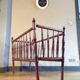 Vintage wooden child bed turned