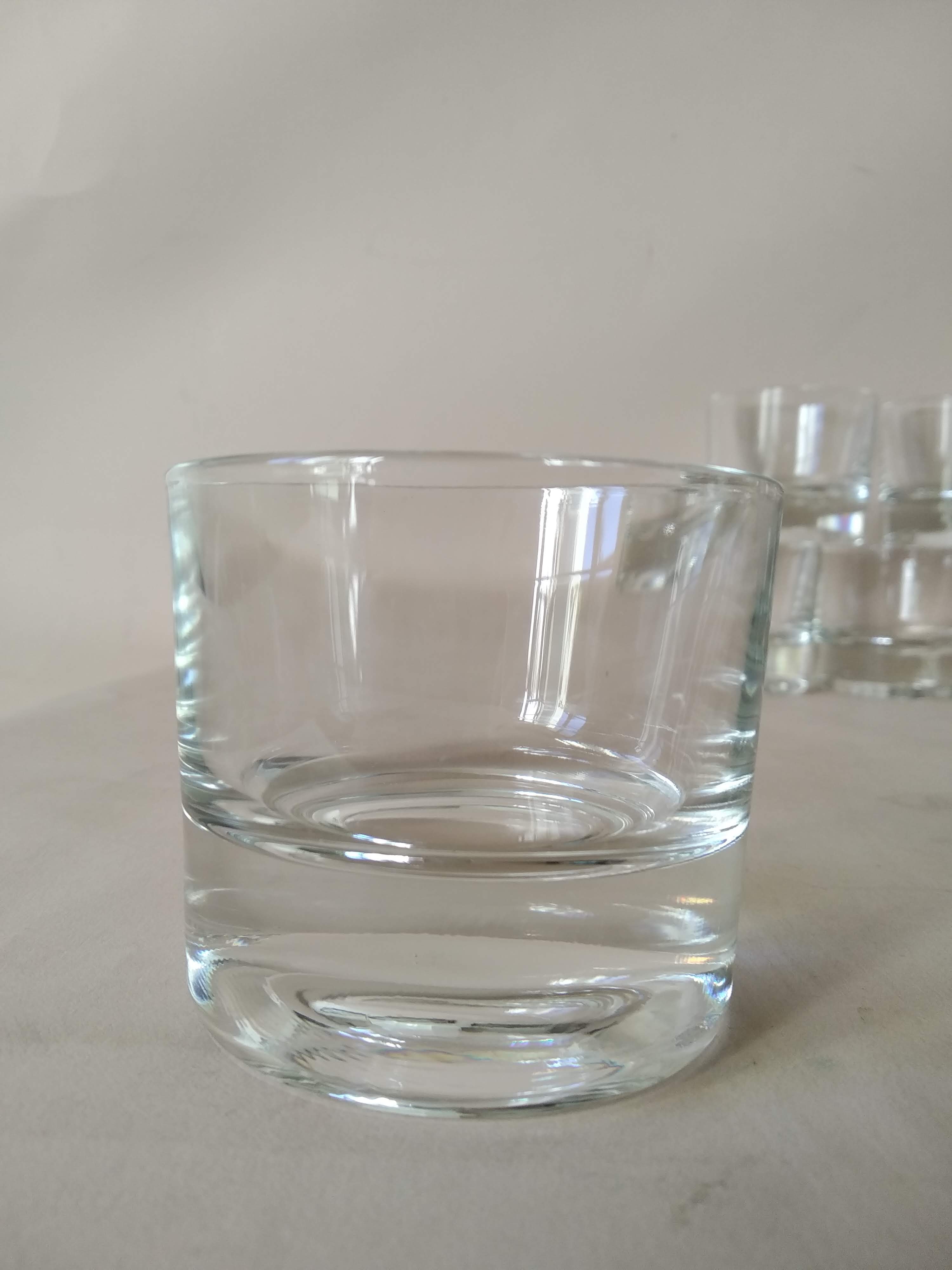 Glasses cups with thick bottom with water or vintage spirits 70