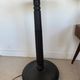 Vintage floor lamp in black patinated wood and striped lampshade