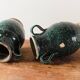 Set of two Chinese green glazed stoneware storage jars.