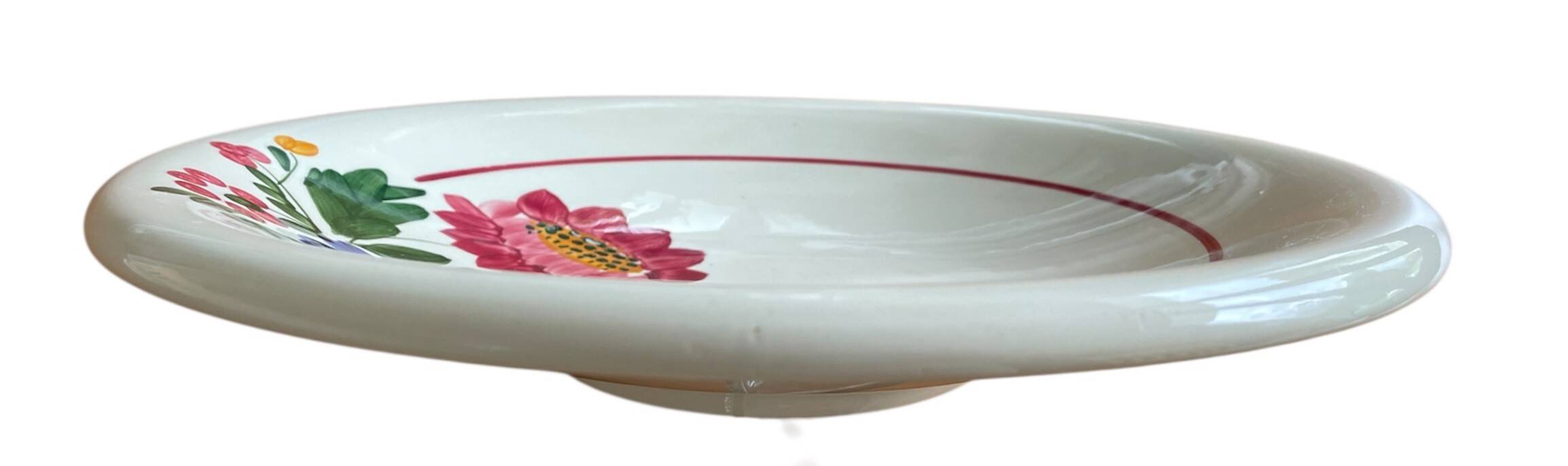 Large antique salad bowl on a pedestal, made of Sarreguemines earthenware.