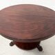 Empire style round table with claw feet, 19th century.
