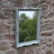 Vintage wall mirror in carved blue-green wood – rococo style – H48 cm
