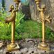 Pair of large candlesticks with cherubs