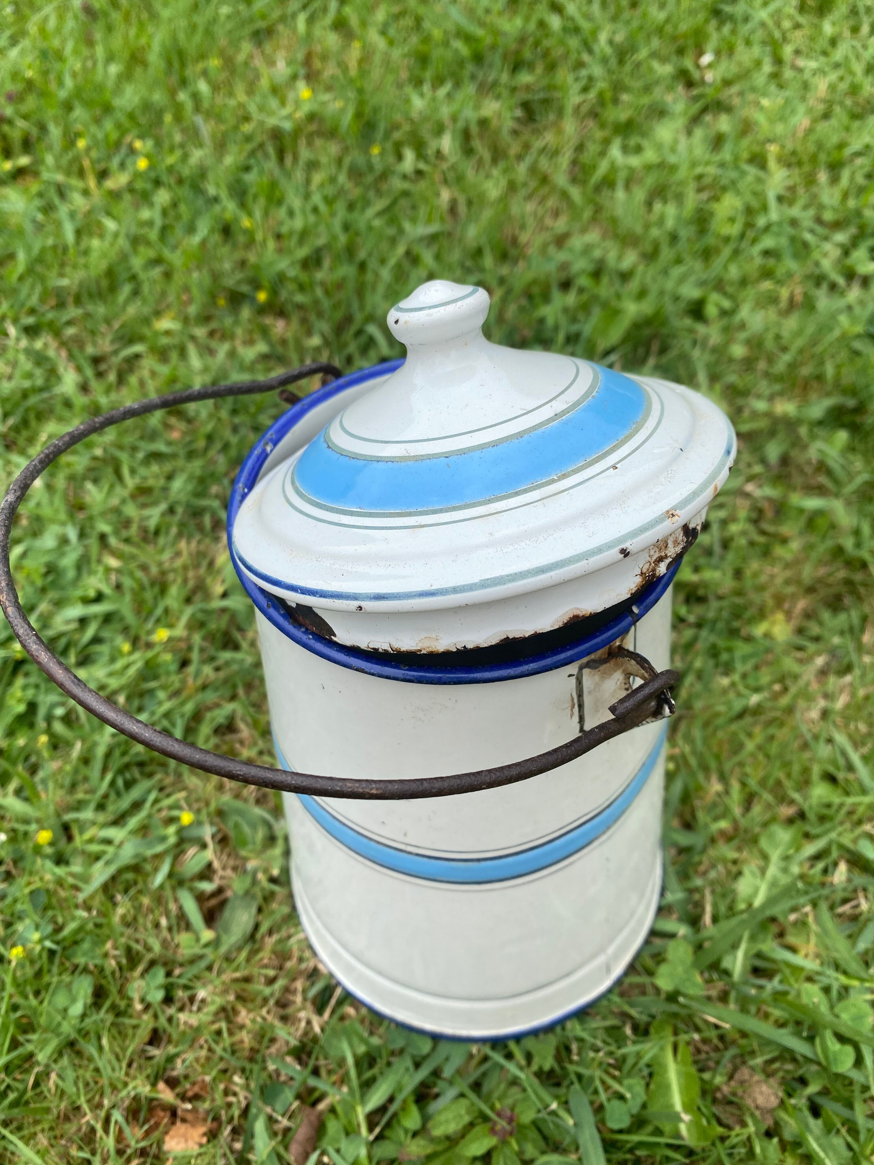 Old milk pot in enamelled sheet metal