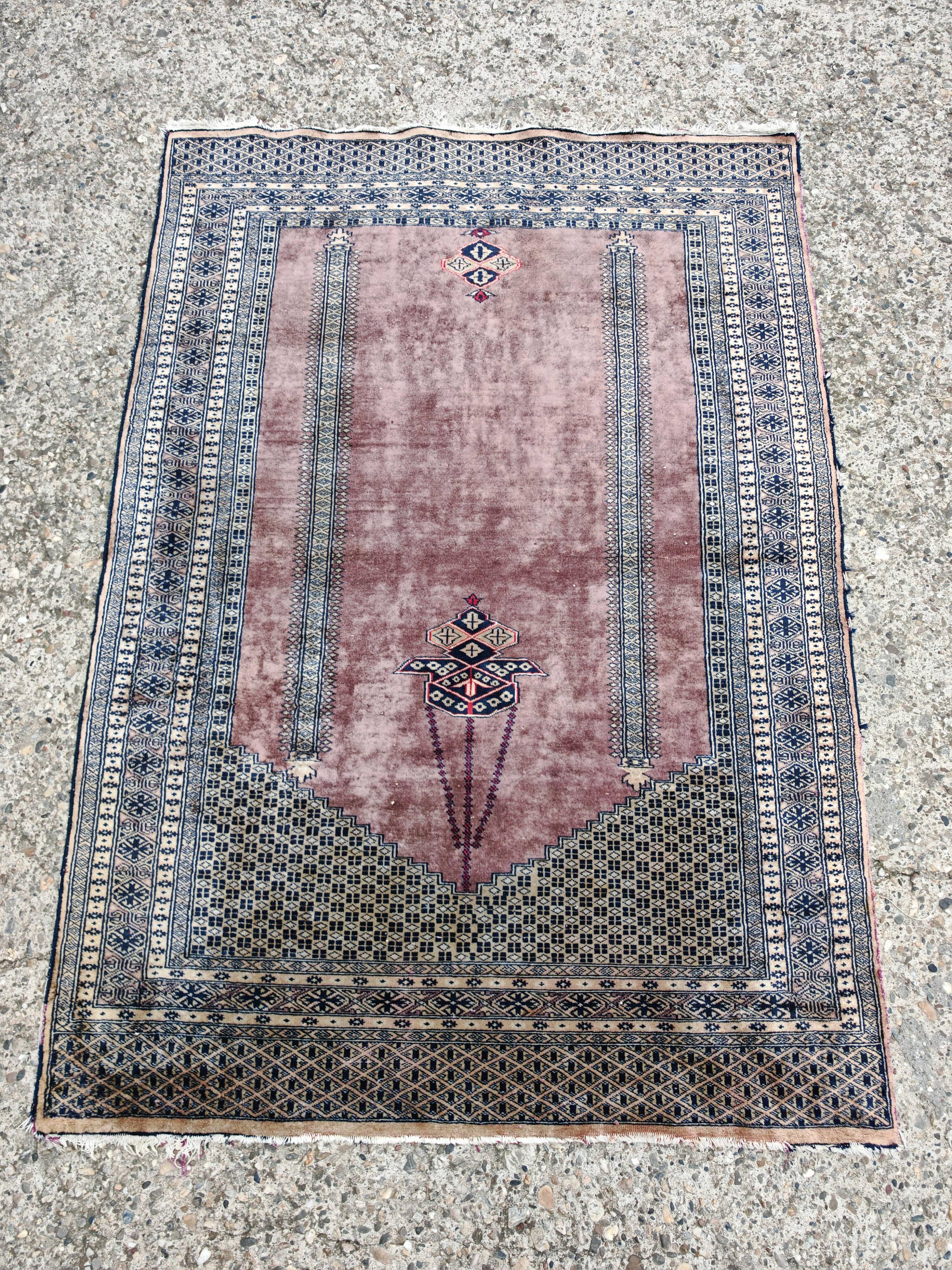 Vintage Anatolian prayer rug made of hand-knotted wool.