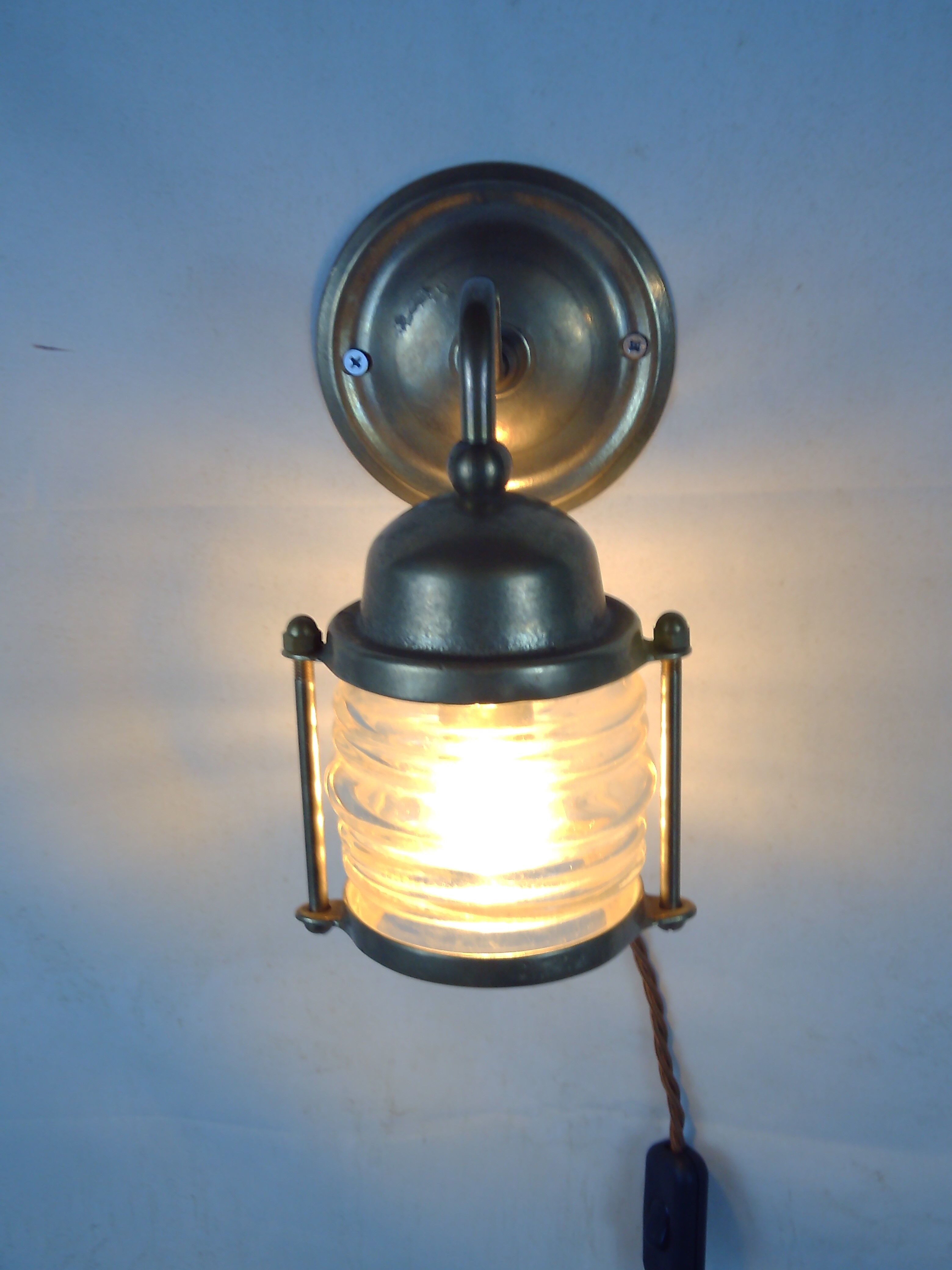 Vintage wallmounted brass lamp from a ship.