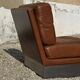 2 armchairs and 1 ottoman in brushed aluminium and brown leather, France, 1970.