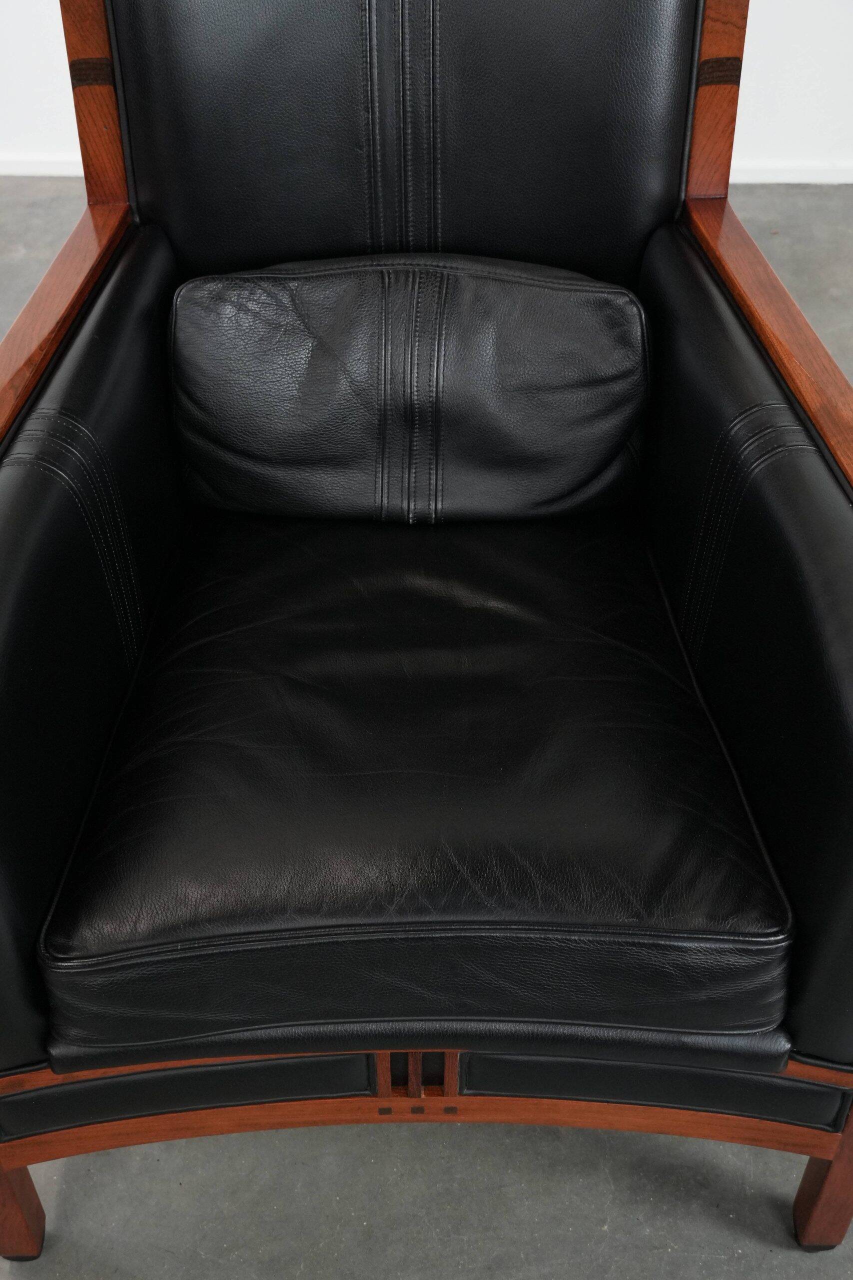 Beautiful and very comfortable black Art Deco design armchair
