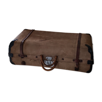 Old suitcase in canvas, wood and metal