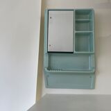 Baby blue plastic mirror and wash station